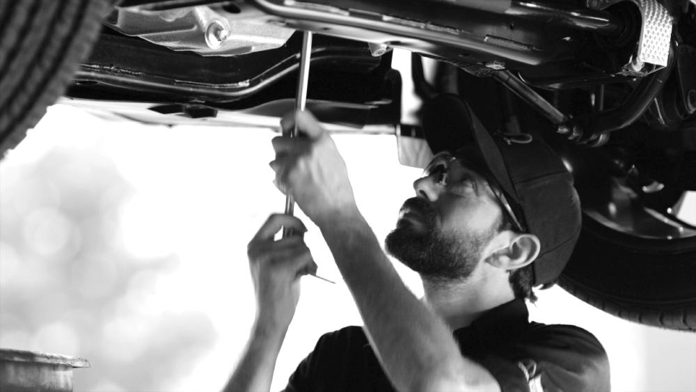 Mechanic under a car